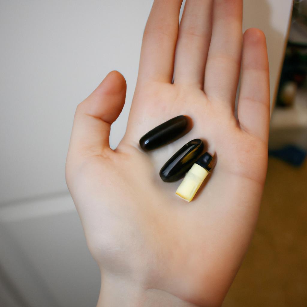 Person holding weight loss supplements